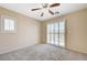 Bedroom featuring plantation shutters and sliding doors at 1158 Gecko Rd, Henderson, NV 89002