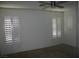 Bright bedroom with a ceiling fan and plantation shutters at 1158 Gecko Rd, Henderson, NV 89002
