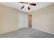 Bedroom featuring a ceiling fan and double door closet at 1158 Gecko Rd, Henderson, NV 89002