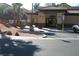 Welcoming entrance to the building with tile roof and desert landscaping at 1158 Gecko Rd, Henderson, NV 89002