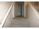 Hallway view of neutral colors and carpeted floors at 1158 Gecko Rd, Henderson, NV 89002