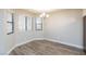 Inviting dining area with wood-look flooring and large windows offering ample natural light at 1201 Sulphur Springs Ln # 101, Las Vegas, NV 89128