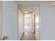 Hallway view with multiple closets and an open doorway at the end of the hall at 1201 Sulphur Springs Ln # 101, Las Vegas, NV 89128