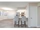 Open floor plan showcasing a kitchen with stainless steel appliances and an island with counter seating at 1201 Sulphur Springs Ln # 101, Las Vegas, NV 89128