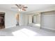 Spacious main bedroom featuring a ceiling fan and mirrored closet doors at 1201 Sulphur Springs Ln # 101, Las Vegas, NV 89128