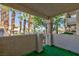 Balcony view with palm trees and a building complex visible in the background at 1201 Sulphur Springs Ln # 101, Las Vegas, NV 89128