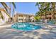 Community pool and surrounding condos with lush landscaping in a tropical environment at 1201 Sulphur Springs Ln # 101, Las Vegas, NV 89128