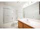 Clean bathroom featuring a shower-tub combo with a glass sliding door and a white vanity top at 1316 Driscoll Dr # 201, Las Vegas, NV 89128