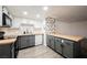 Kitchen with butcher block countertops, grey lower cabinets, and black hardware at 1316 Driscoll Dr # 201, Las Vegas, NV 89128
