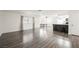 Open concept living room with wood floors and an attached breakfast nook at 1316 Driscoll Dr # 201, Las Vegas, NV 89128