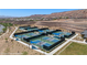 Outdoor pickleball courts with green and blue surface, set against a desert landscape at 1424 Pin Cushion Rdg, Mesquite, NV 89034