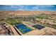 Community tennis courts, clubhouse, and putting greens blend harmoniously with desert mountain views at 1424 Pin Cushion Rdg, Mesquite, NV 89034