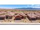 A beautiful aerial view showcases the home's location near mountain views and desert landscaping at 1424 Pin Cushion Rdg, Mesquite, NV 89034
