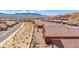 Aerial view showcases a well-kept residential neighborhood nestled within desert landscaping at 1424 Pin Cushion Rdg, Mesquite, NV 89034