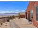 Backyard has desert landscaping, mountain views, and covered patio at 1424 Pin Cushion Rdg, Mesquite, NV 89034