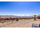 Backyard desert landscape with mountain views and a tiled patio at 1424 Pin Cushion Rdg, Mesquite, NV 89034