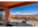 Back patio with dining, desert landscaping, and mountain views at 1424 Pin Cushion Rdg, Mesquite, NV 89034