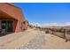 Expansive backyard featuring desert landscaping, mountain views, and a covered patio seating area at 1424 Pin Cushion Rdg, Mesquite, NV 89034