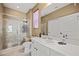 Bright bathroom featuring a glass shower, a white vanity with sink, and tile floors at 1424 Pin Cushion Rdg, Mesquite, NV 89034