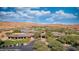 The community clubhouse features sprawling green lawns and stunning desert views at 1424 Pin Cushion Rdg, Mesquite, NV 89034