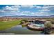 An aerial view of the community pool with seating, umbrellas and desert views at 1424 Pin Cushion Rdg, Mesquite, NV 89034