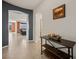 Entryway featuring a table, tile flooring, and views into the living room with picturesque windows at 1424 Pin Cushion Rdg, Mesquite, NV 89034