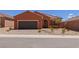 Charming home with a desert landscape and a two-car garage at 1424 Pin Cushion Rdg, Mesquite, NV 89034