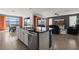 Open-concept kitchen and living space with mountain view, featuring stainless steel appliances and granite countertops at 1424 Pin Cushion Rdg, Mesquite, NV 89034