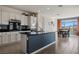 Spacious kitchen features granite countertops, white cabinetry, and adjacent dining area with mountain views at 1424 Pin Cushion Rdg, Mesquite, NV 89034