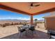 Covered outdoor patio with mountain views, perfect for entertaining or relaxation at 1424 Pin Cushion Rdg, Mesquite, NV 89034