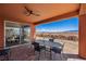 Mountain views from the covered patio with outdoor seating and backyard at 1424 Pin Cushion Rdg, Mesquite, NV 89034