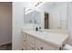 Bright bathroom featuring a vanity, framed mirror, and a well lit space at 1509 Linnbaker Ln # 203, Las Vegas, NV 89110