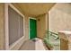 A doorway with a security screen door, number 203, and a planter on the balcony at 1509 Linnbaker Ln # 203, Las Vegas, NV 89110
