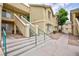 Exterior view of the building with a green roof, outdoor stairs, and walkways at 1509 Linnbaker Ln # 203, Las Vegas, NV 89110
