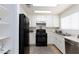 Functional kitchen with white cabinetry and modern appliances at 1509 Linnbaker Ln # 203, Las Vegas, NV 89110