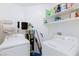 Laundry room with washer, dryer, shelving and plenty of room to store your cleaning supplies at 1509 Linnbaker Ln # 203, Las Vegas, NV 89110
