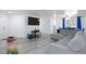 Bright living room with modern flooring, open layout to dining area, and neutral decor at 1509 Linnbaker Ln # 203, Las Vegas, NV 89110
