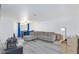 Inviting living room featuring grey, wood-look flooring and a comfortable sectional sofa at 1509 Linnbaker Ln # 203, Las Vegas, NV 89110