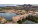 Stunning aerial view of lakeside homes, mountains, and a bridge featuring colorful architecture at 17 Grand Corniche Dr, Henderson, NV 89011