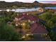 Stunning aerial view showcasing the home, lake views, landscaping, and surrounding neighborhood at 17 Grand Corniche Dr, Henderson, NV 89011