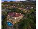 Expansive property showcasing a two-story home, pool, lush greenery, and neighborhood at 17 Grand Corniche Dr, Henderson, NV 89011