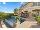 Luxury home featuring a pool with a water feature and an expansive patio area perfect for entertaining at 17 Grand Corniche Dr, Henderson, NV 89011