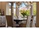 Dining room showcasing mountain views, accented by elegant chandelier lighting at 17 Grand Corniche Dr, Henderson, NV 89011