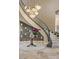 Grand foyer showcases a spiral staircase, decorative chandelier, and elegant decor at 17 Grand Corniche Dr, Henderson, NV 89011