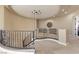 Second floor landing with wrought iron railing and recessed lighting at 17 Grand Corniche Dr, Henderson, NV 89011