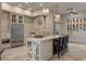 Spacious kitchen featuring a large island with seating, modern appliances, and custom cabinets at 17 Grand Corniche Dr, Henderson, NV 89011