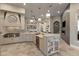Spacious kitchen featuring an island, modern appliances, and stylish lighting at 17 Grand Corniche Dr, Henderson, NV 89011