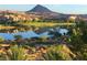 Picturesque lake view with golf course and mountains in the background on a sunny day at 17 Grand Corniche Dr, Henderson, NV 89011