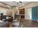 Open-concept living room with a bar, cozy seating, and stylish sliding door at 17 Grand Corniche Dr, Henderson, NV 89011