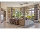 Bright and airy living room with a large window, comfortable seating, and stylish decor at 17 Grand Corniche Dr, Henderson, NV 89011